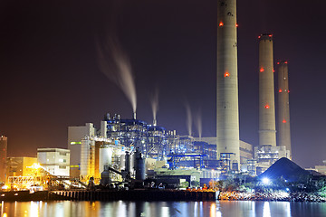 Image showing power station at night with smoke