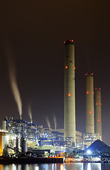 Image showing power station at night with smoke