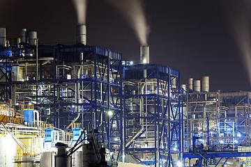 Image showing power station at night with smoke