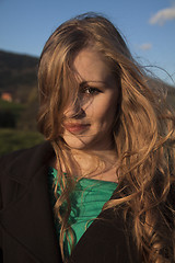 Image showing Young long-haired curly blonde woman