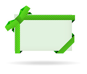 Image showing green gift card with dashed ribbon, dashed bow and shadow on whi
