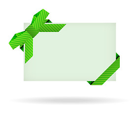 Image showing green gift card with dashed ribbon, dashed bow and shadow on whi