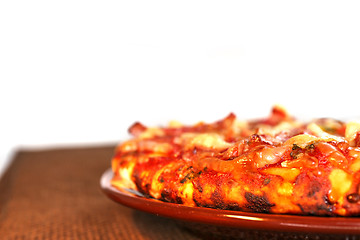 Image showing pizza on the brown plate, isolated