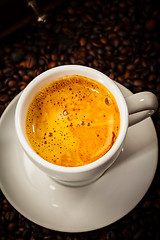 Image showing Espresso cup in coffee beans