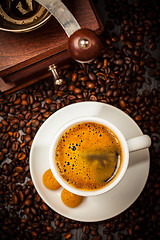 Image showing Espresso cup in coffee beans