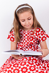 Image showing Schoolgirl reading book