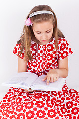 Image showing Schoolgirl reading book