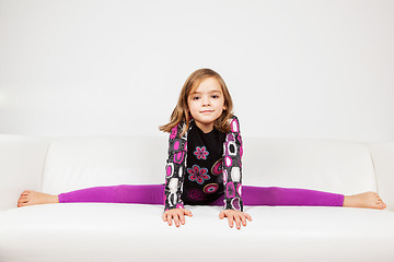 Image showing Cute little girl making splits