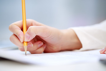 Image showing Female hand writing, close up