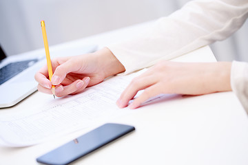 Image showing Female hand writing, close up