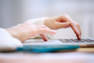 Image showing Close-up shot typing on the laptop keyboard