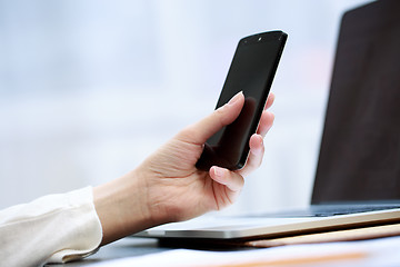 Image showing Woman using a mobile phone 