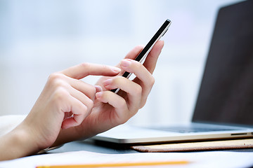 Image showing Woman using a mobile phone 