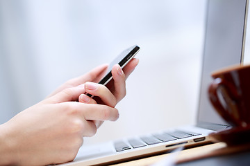 Image showing Close up of a woman using smartphone