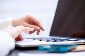 Image showing Close-up shot typing on the laptop keyboard