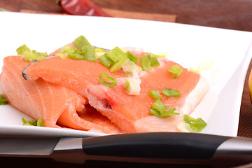 Image showing salmon filet with fresh herbs