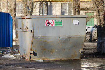 Image showing Large garbage container on the background of dirty streets