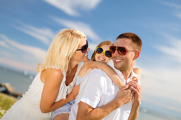 Image showing happy family in sunglasses having fun outdoors