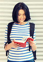 Image showing woman with bag and book