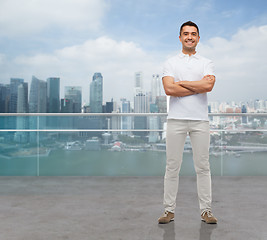 Image showing smiling man with crossed arms