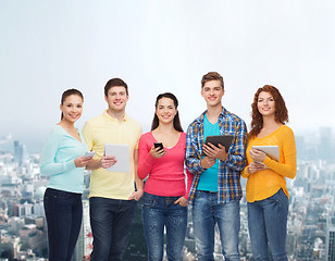 Image showing group of teenagers with smartphones and tablet pc