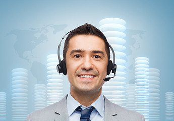 Image showing smiling businessman in headset over bit coin