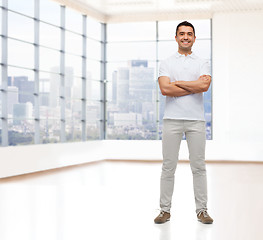 Image showing smiling man with crossed arms