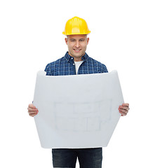 Image showing smiling male builder in helmet with blueprint