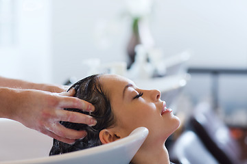 Image showing happy young woman at hair salon