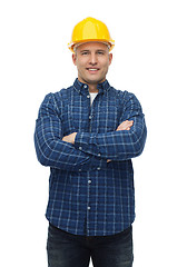 Image showing smiling male builder or manual worker in helmet