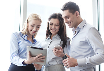 Image showing business team working with tablet pcs in office