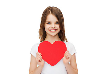 Image showing smiling little girl with red heart