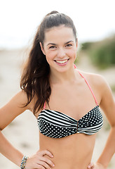 Image showing happy young woman on beach