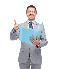 Image showing happy businessman with folder showing thumbs up