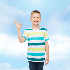 Image showing little boy in casual clothes making ok gesture