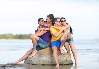 Image showing happy friends on summer beach