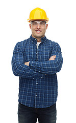 Image showing smiling male builder or manual worker in helmet