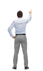 Image showing businessman pointing finger or touching something