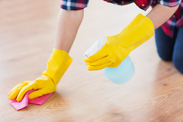 Image showing close up of woman with rag cleaning floor at home