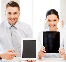 Image showing business team showing tablet pcs in office