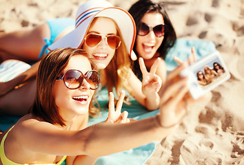 Image showing girls taking self photo on the beach