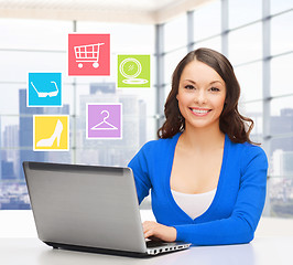 Image showing smiling businesswoman or student with laptop