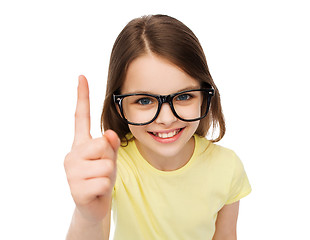 Image showing smiling cute little girl in black eyeglasses