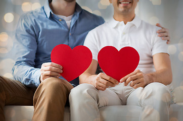 Image showing close up of happy gay male couple with red hearts