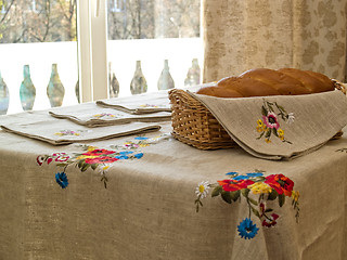 Image showing Table with bread and table-cloth