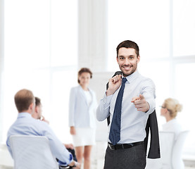 Image showing handsome buisnessman with jacket over shoulder