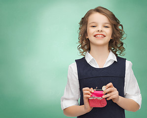 Image showing happy girl with purse and euro coin money