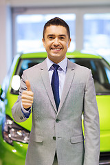 Image showing man showing thumbs up at auto show or car salon