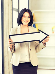 Image showing businesswoman with direction arrow sign