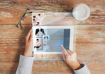 Image showing close up of hands with tablet pc and web page